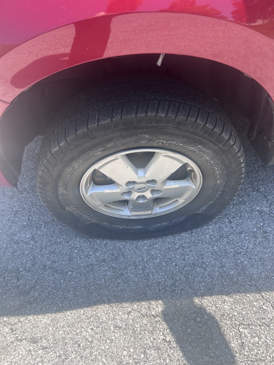 Tire replacement on an SUV at a customer's location