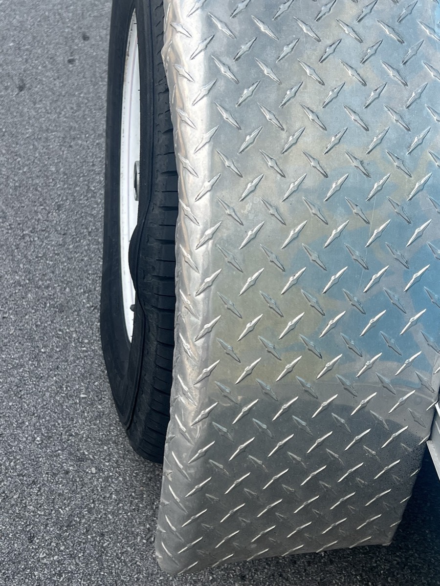 Wheel and tire loaded on Vinny's service truck
